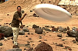 Ashwin Vasavada - planetary scientist at JPL - throws a Frisbee in the mars yard.